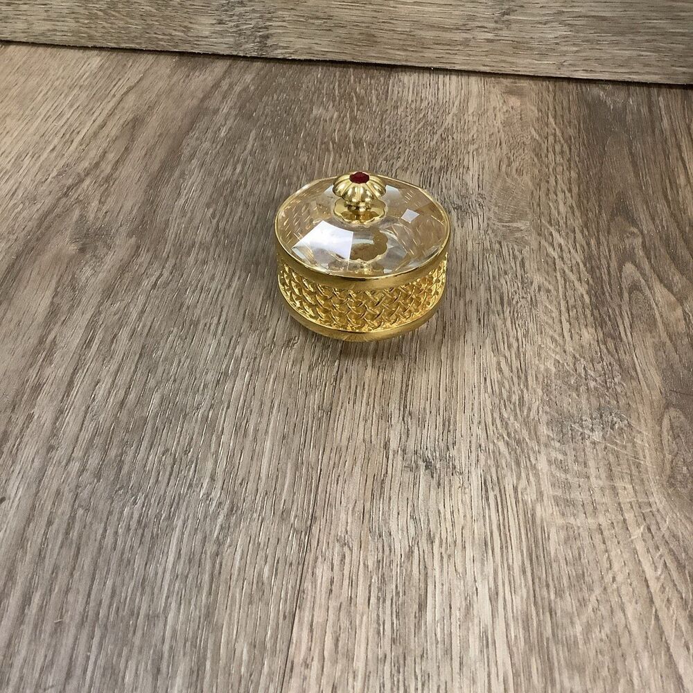 Vintage 1985 gold and clear round trinket box mesh sides red stone handle